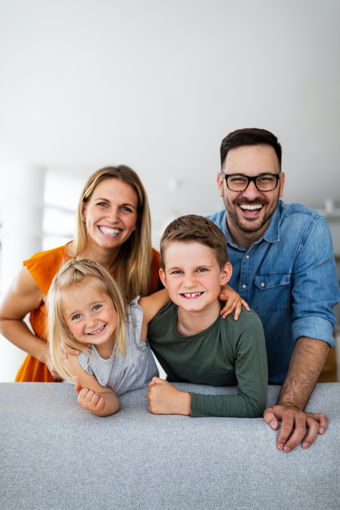 Portrait of happy smiling family at home